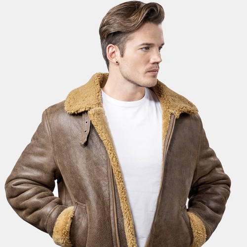 model wearing leather jacket brwon looking away