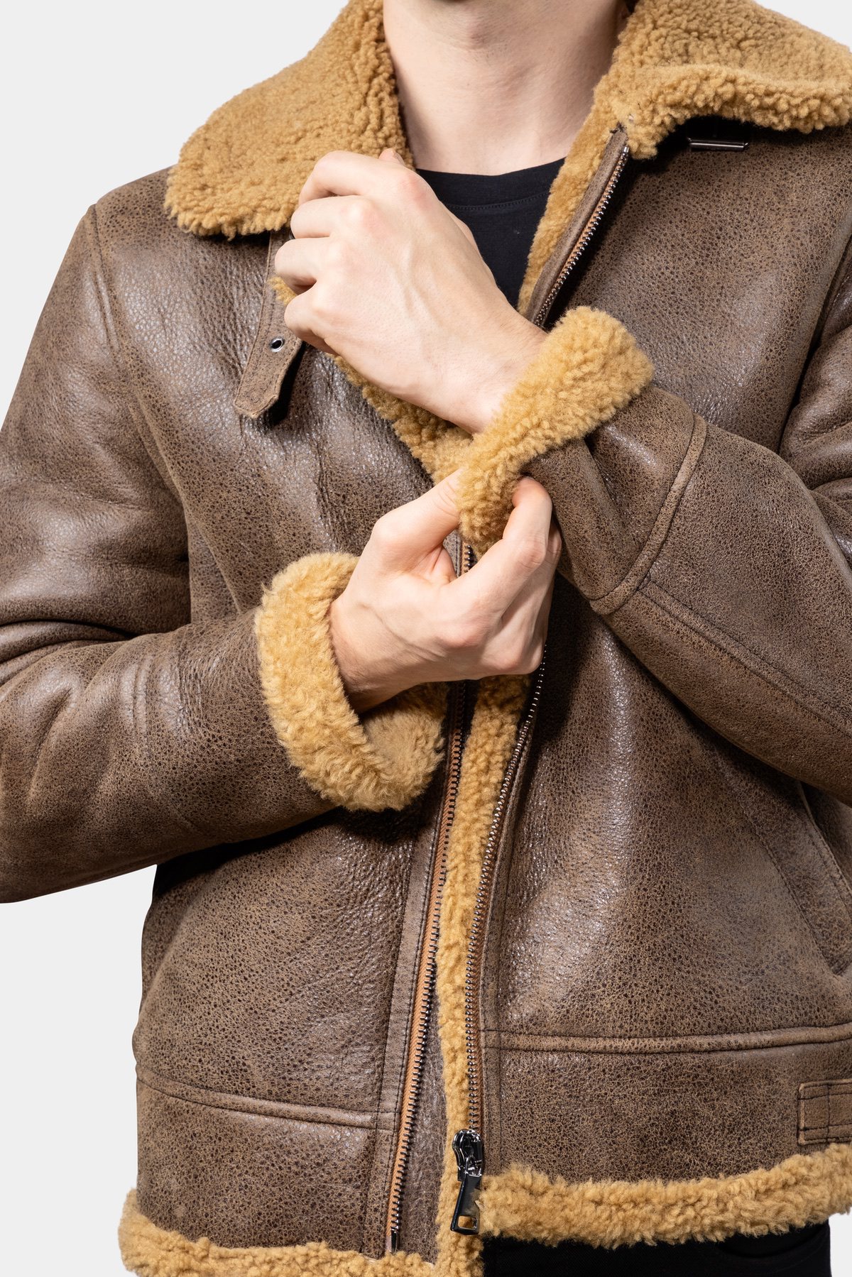 Shearling Leather Jacket - Brown Model wearing Mens Brown Shearling Leather Jacket presenting the sleeve